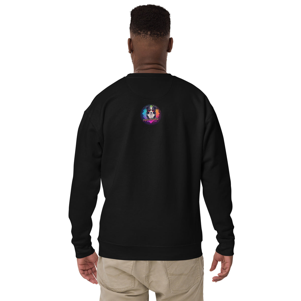 Scout- Home Is Where The Couch Is! Sweatshirt lifestyle shot — Black male model back view wearing black sweatshirt showing Stylin' & Profilin' border collie logo badge on upper back on white background