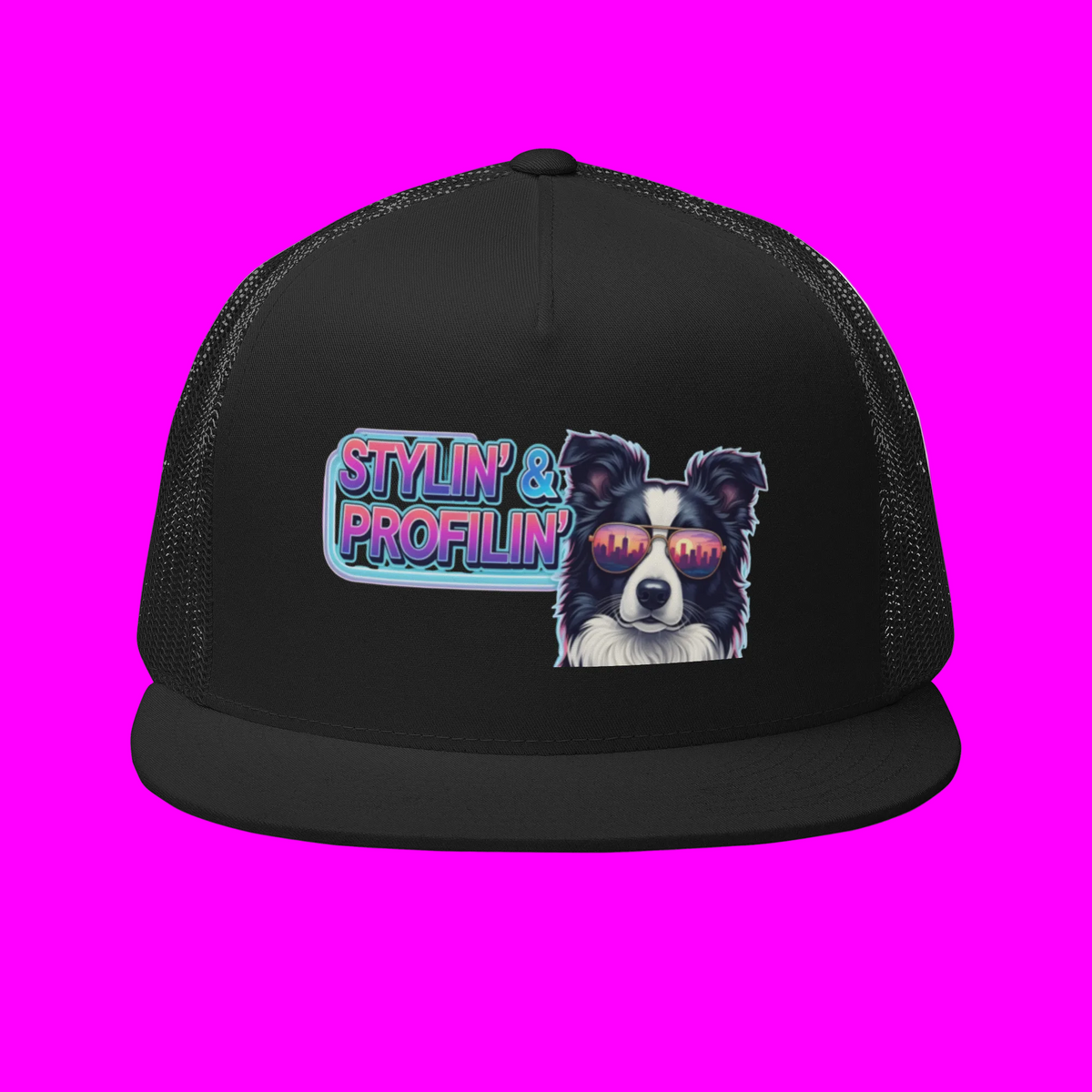 Stylin' Trucker Cap front view — Scout border collie with neon Stylin' & Profilin' logo patch on all-black crown with black mesh back on hot pink background