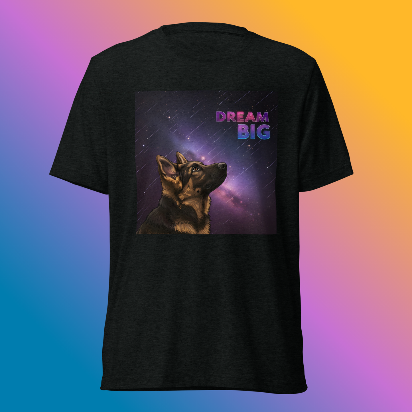 Dream Big Shepherd Unisex T-Shirt product shot — black tri-blend tee with German Shepherd dog gazing upward into glowing purple cosmic nebula with Dream Big text on bright, colorful gradient background