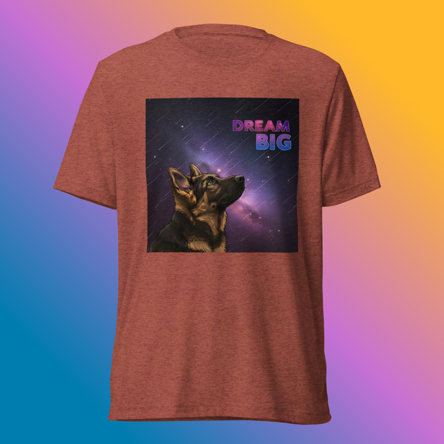 Dream Big Shepherd Unisex T-Shirt product shot — clay tri-blend tee with German Shepherd dog gazing upward into glowing purple cosmic nebula with Dream Big text on bright, colorful gradient background