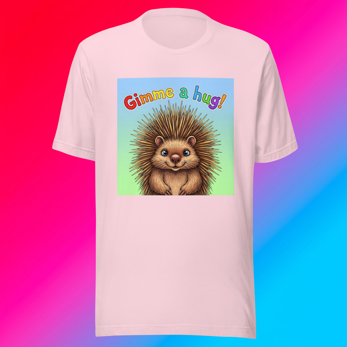 Gimme A Hug! Unisex T-Shirt product shot — soft pink tee with cute smiling hedgehog and rainbow Gimme a hug! text on blue-to-green gradient panel on red-to-light blue gradient background