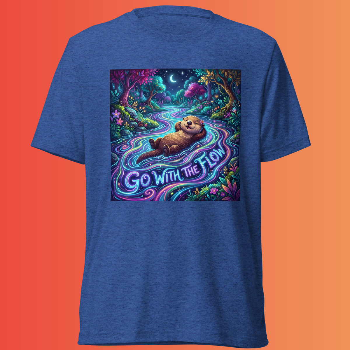 Royal-blue Go With The Flow T-shirt featuring an otter floating in a glowing forest stream with “Go With The Flow” lettering, against an orange background.