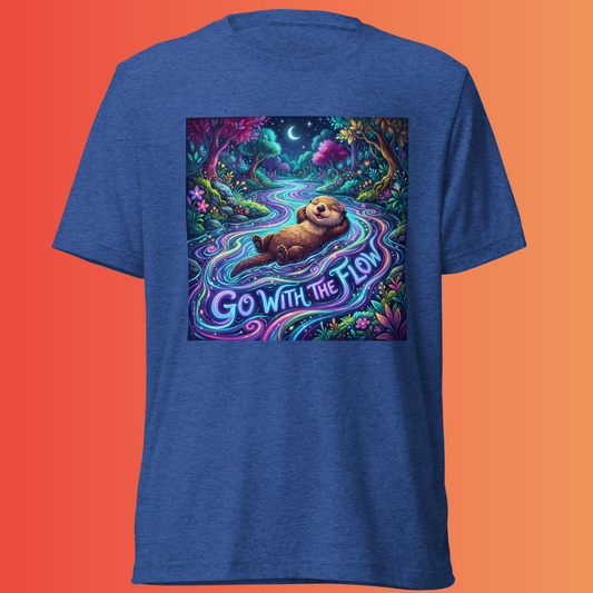 Royal-blue Go With The Flow T-shirt featuring an otter floating in a glowing forest stream with “Go With The Flow” lettering, against an orange background.