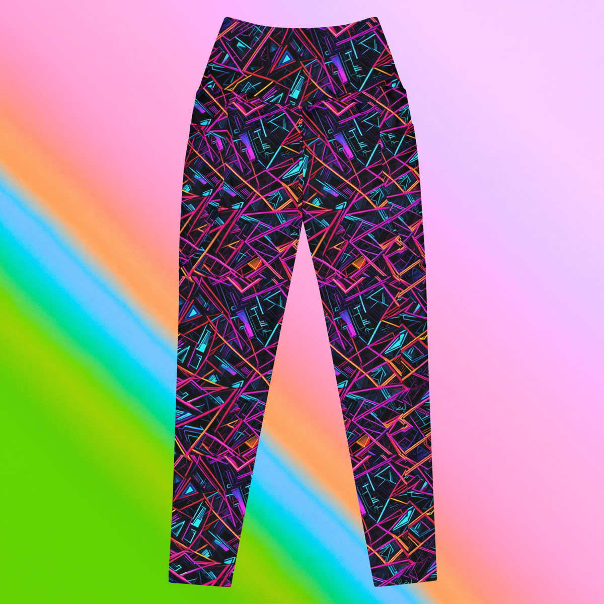 Neon Shatter leggings with pockets hero flat lay — black base with neon pink teal orange and purple shattered geometric all-over print on rainbow gradient background