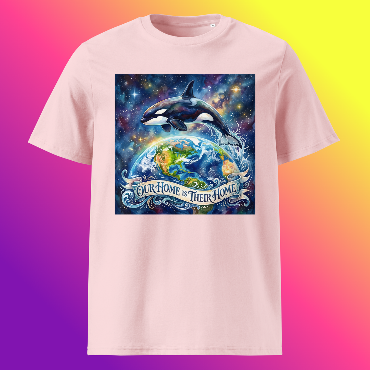 Our Home Is Their Home Unisex T-Shirt product shot — cotton pink tee with orca whale leaping over glowing Earth globe surrounded by cosmic nebula and stars with Our Home Is Their Home banner on yellow, purple, and violet gradient background