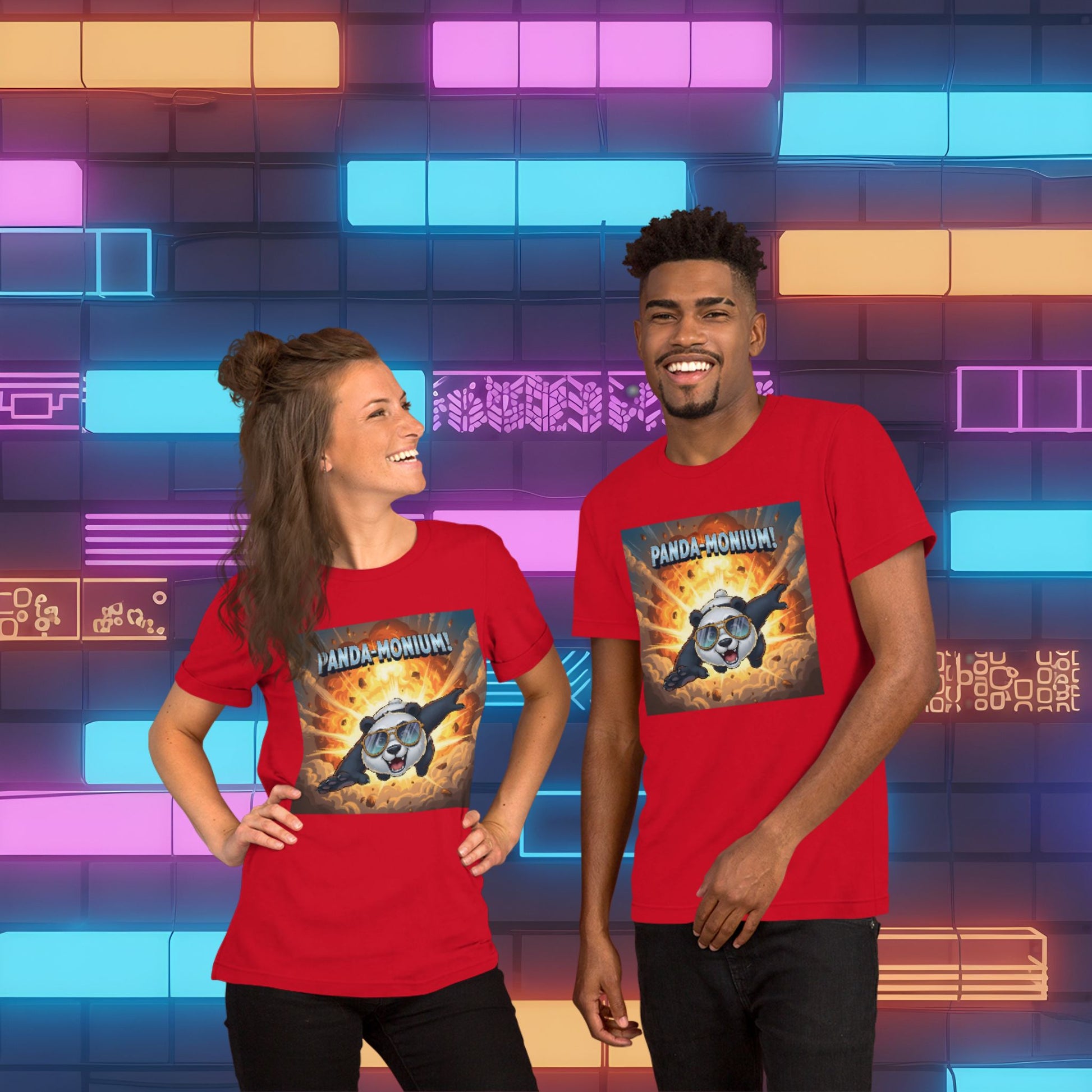 Panda-Monium graphic unisex t-shirt hero shot — man and woman wearing red tees with explosive panda design in neon retro arcade setting.