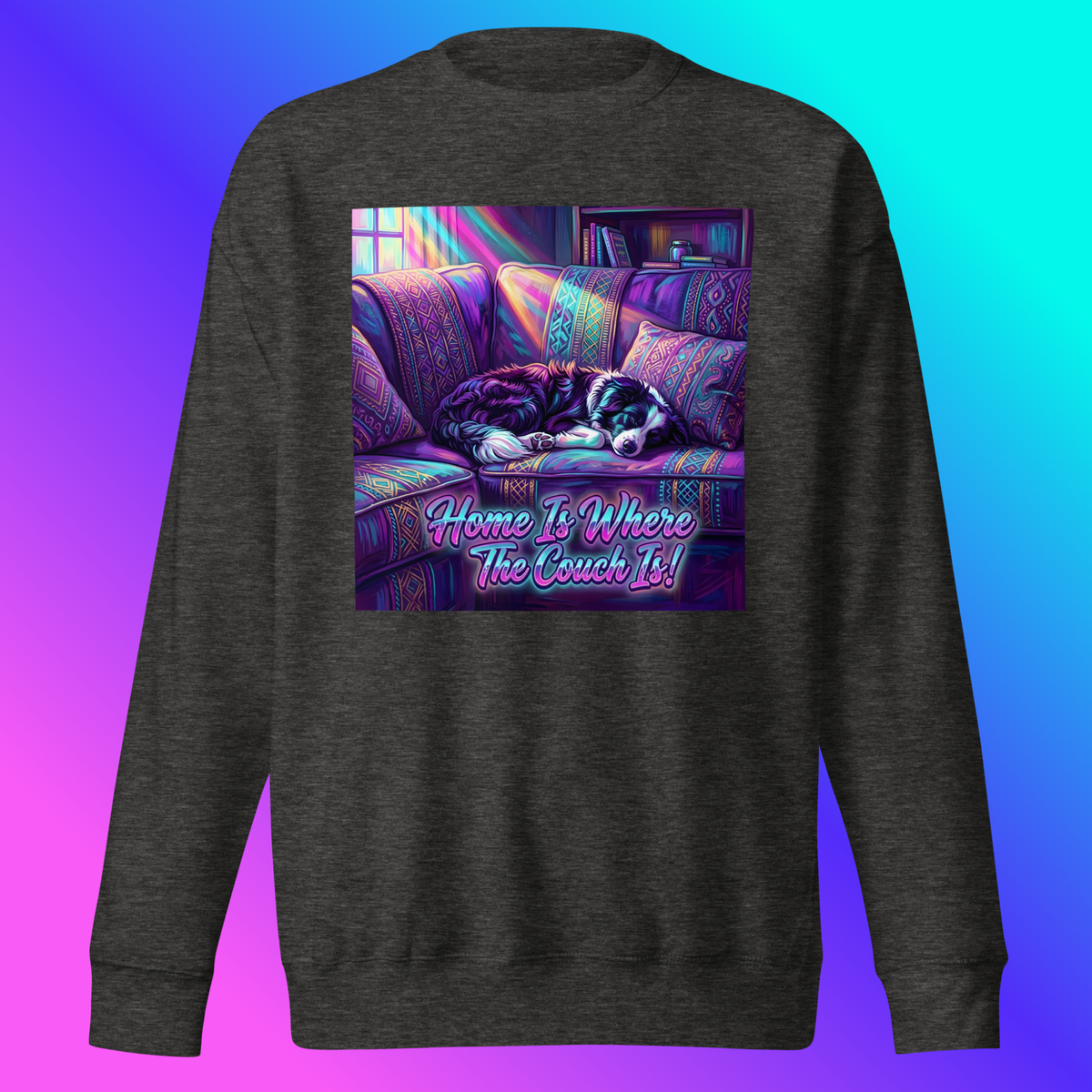 Scout- Home Is Where The Couch Is! Sweatshirt product shot — charcoal heather sweatshirt front view on ghost mannequin showing border collie Scout sleeping on purple boho couch with rainbow light rays and "Home Is Where The Couch Is!" neon pink and teal text against blue-to-teal gradient background