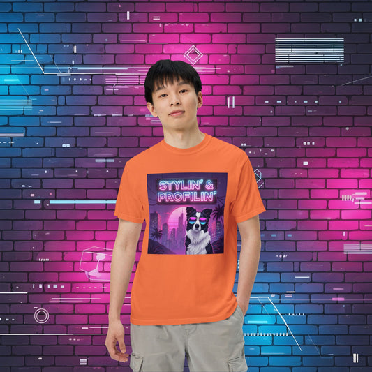 Scout Neon Collie Nights graphic unisex t-shirt hero shot — male model wearing orange tee with neon border collie design in neon brick wall setting.