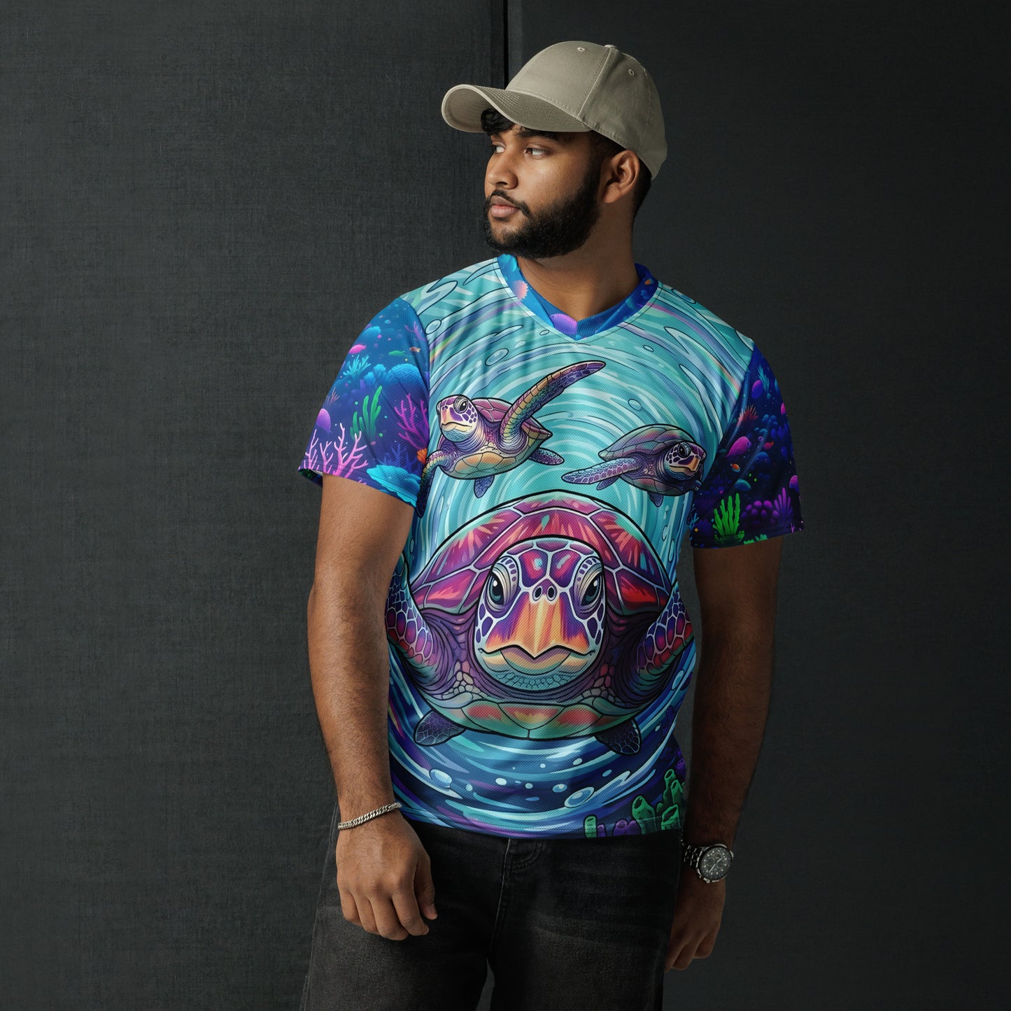 Male model wearing the Tidal Drift Turtles all-over print sports jersey featuring a bold sea turtle face on the front with neon coral reef sleeves