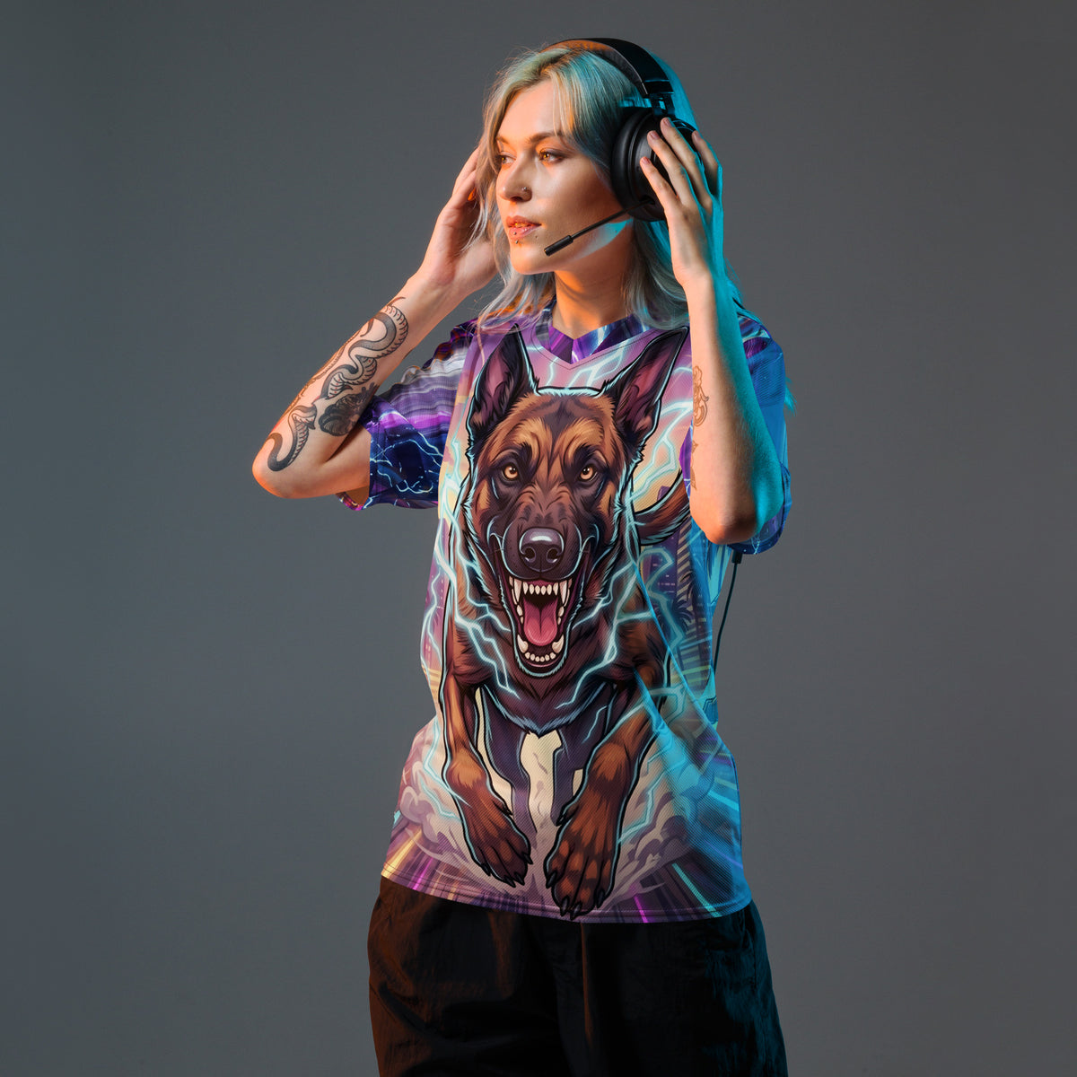 Model wearing a gaming headset and Malinois Mayhem sports jersey, showing the charging Belgian Malinois graphic and lightning-patterned sleeves.