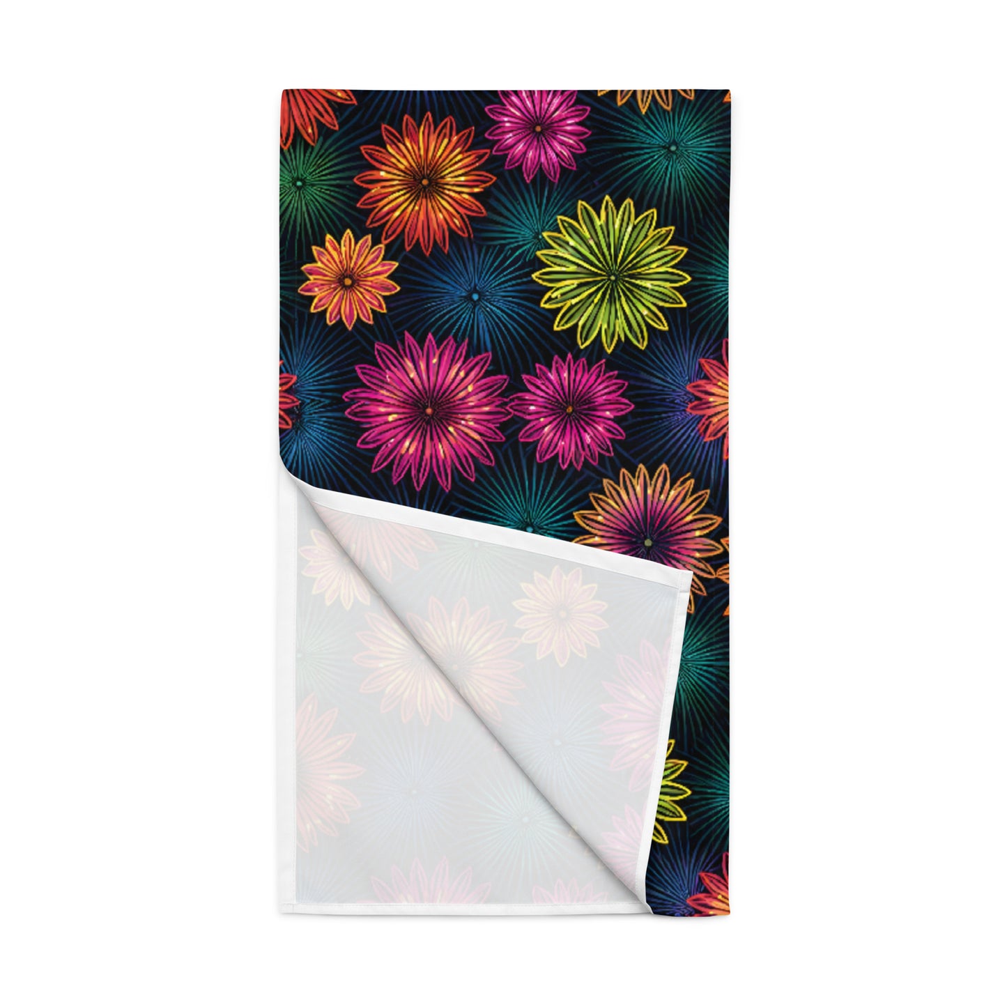 Fluorescent Floral Table Runner product shot — table runner angled flat lay showing all-over print of neon pink orange yellow-green and teal daisy-like flowers with radiating petal details densely packed on dark navy background with white reverse side visible on white background