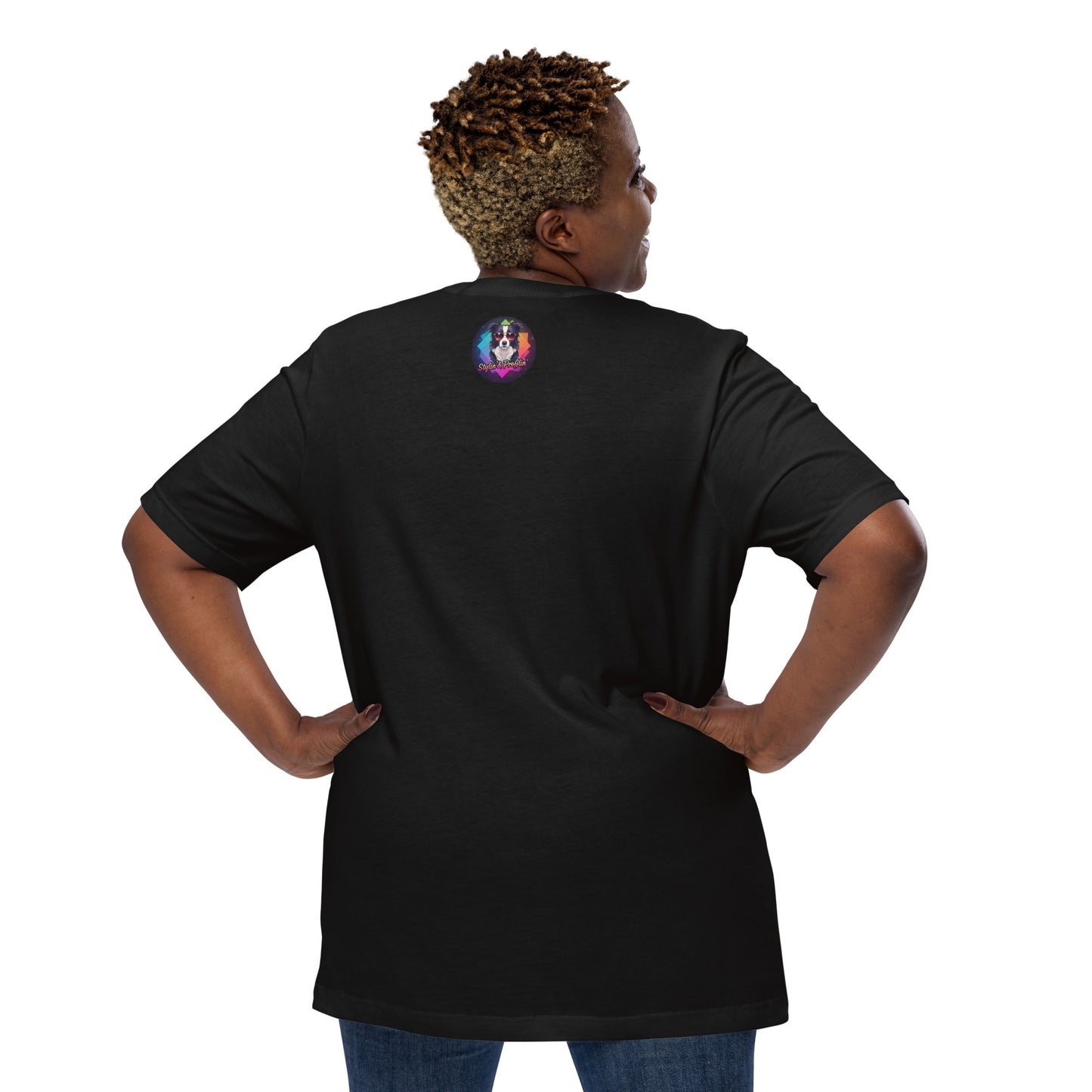 Scout- Happy Howl-o-ween! Unisex T-Shirt lifestyle shot — back view of plus-size Black female model with hands on hips wearing black tee showing Stylin' & Profilin' border collie logo badge at upper back on white background